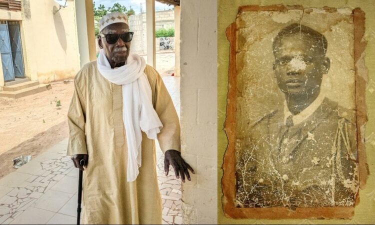 Birame Senghor qui pose au côté de son père, le tirailleur Mbap Senghor, tué à Thiaroye le 1er décembre 1944. © Claire Rivière